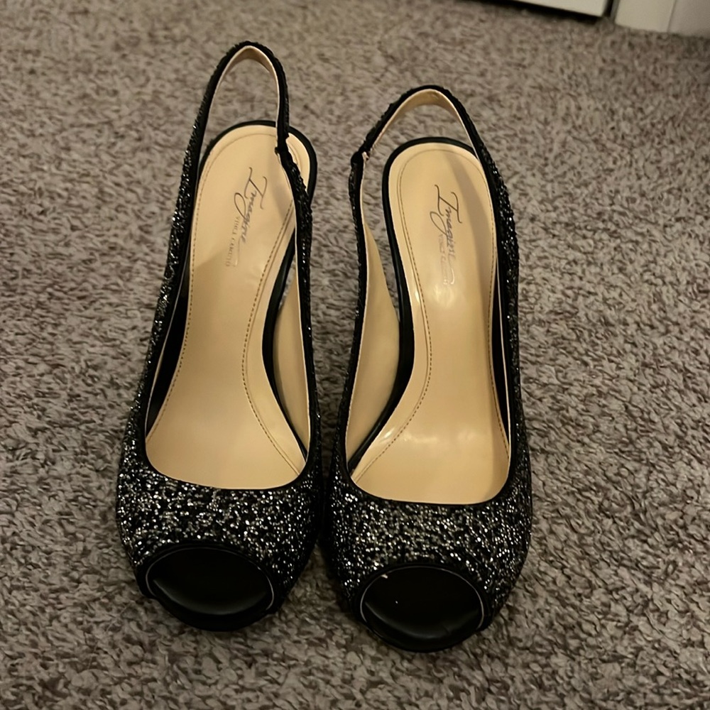 Brand new black sparkly stiletto’s w/ 5 inch silver heel.